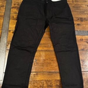 The Topman Regular Slim Jeans in size 34R are a stylish and modern black